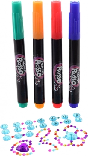 Obojeni flomasteri i sjajni kamenčići