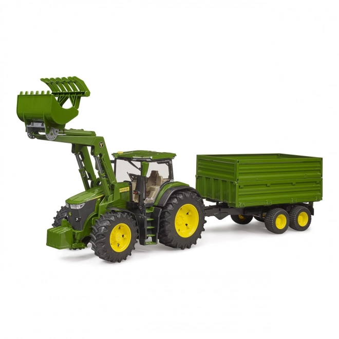 Traktor John Deere 7R s prednjim utovarivačem i prikolicom