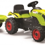 Traktor na pedale CLAAS sa zelenom prikolicom